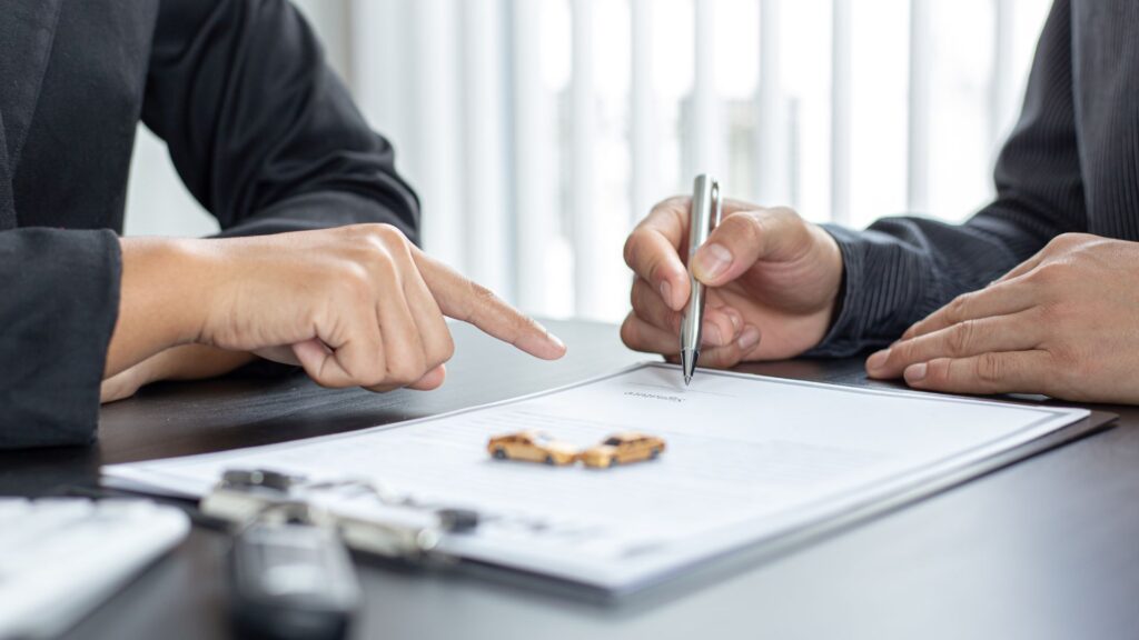 Insurance agent reviewing a policy with a homeowner about What's Driving Higher Home Insurance Costs?