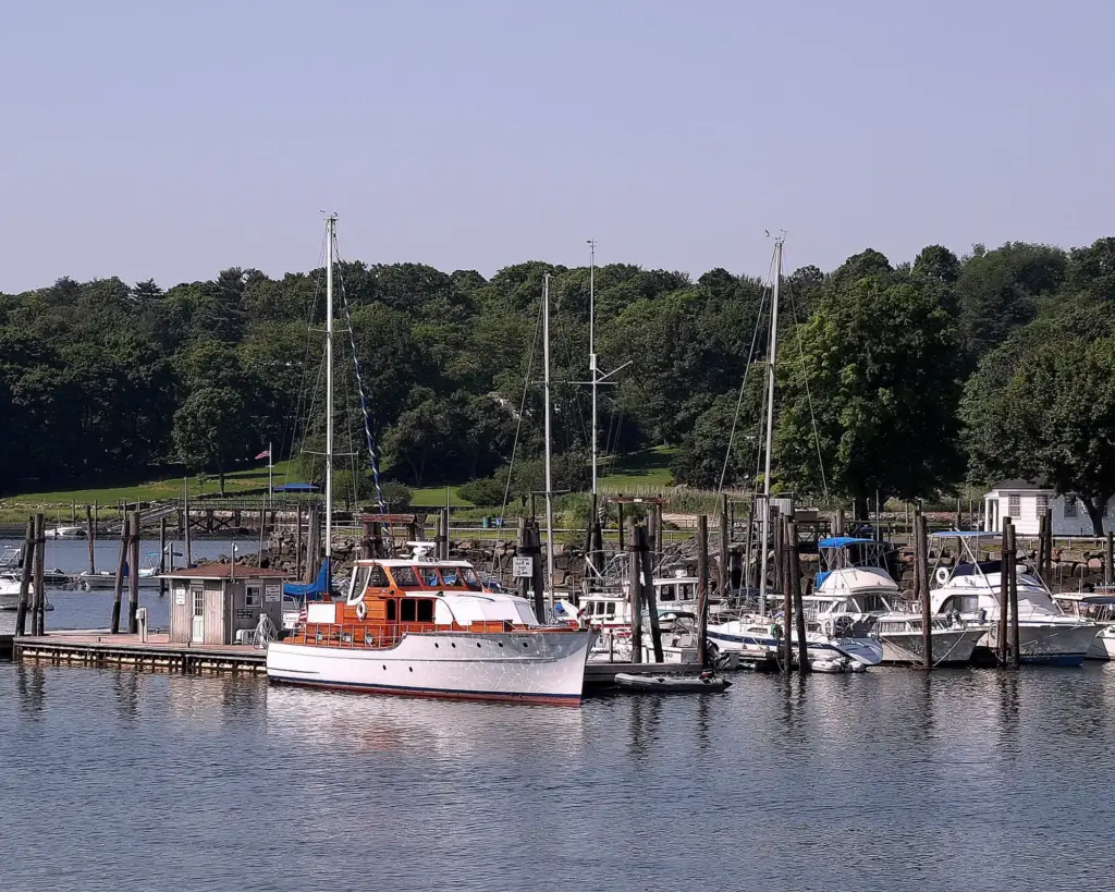 Sailboats and motorboats docked in a harbor in Greenwich, CT